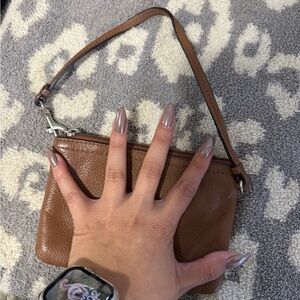 Coach brown leather wristlet.